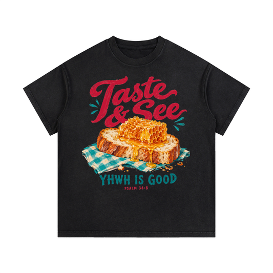 Front view of black Taste & See vintage-wash cotton tee with Psalm 34:8 bread-and-honey artwork