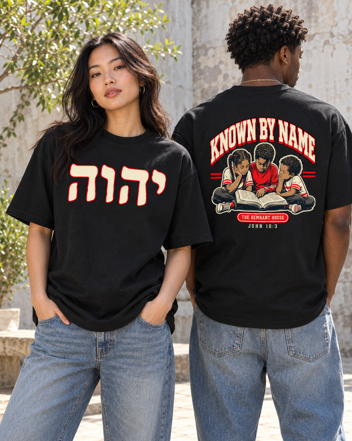 Front and back campaign mockup of the black Known by Name cotton tee in a sunlit courtyard