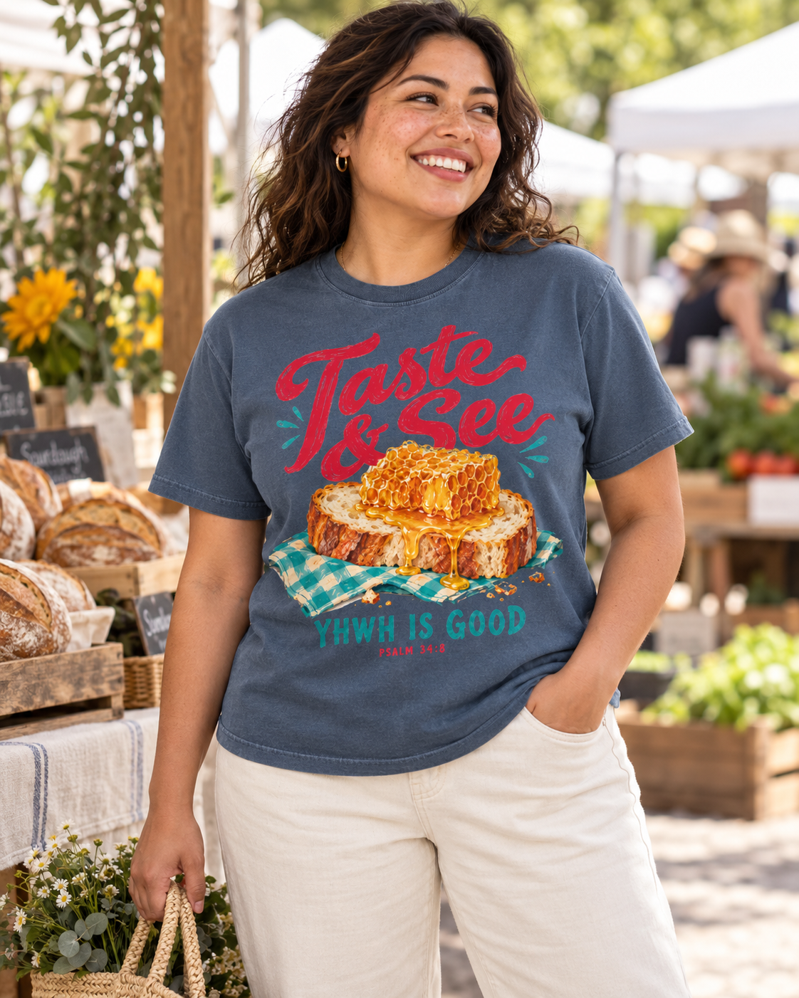 Lifestyle mockup of the gray blue Taste & See vintage-wash cotton tee at an outdoor market